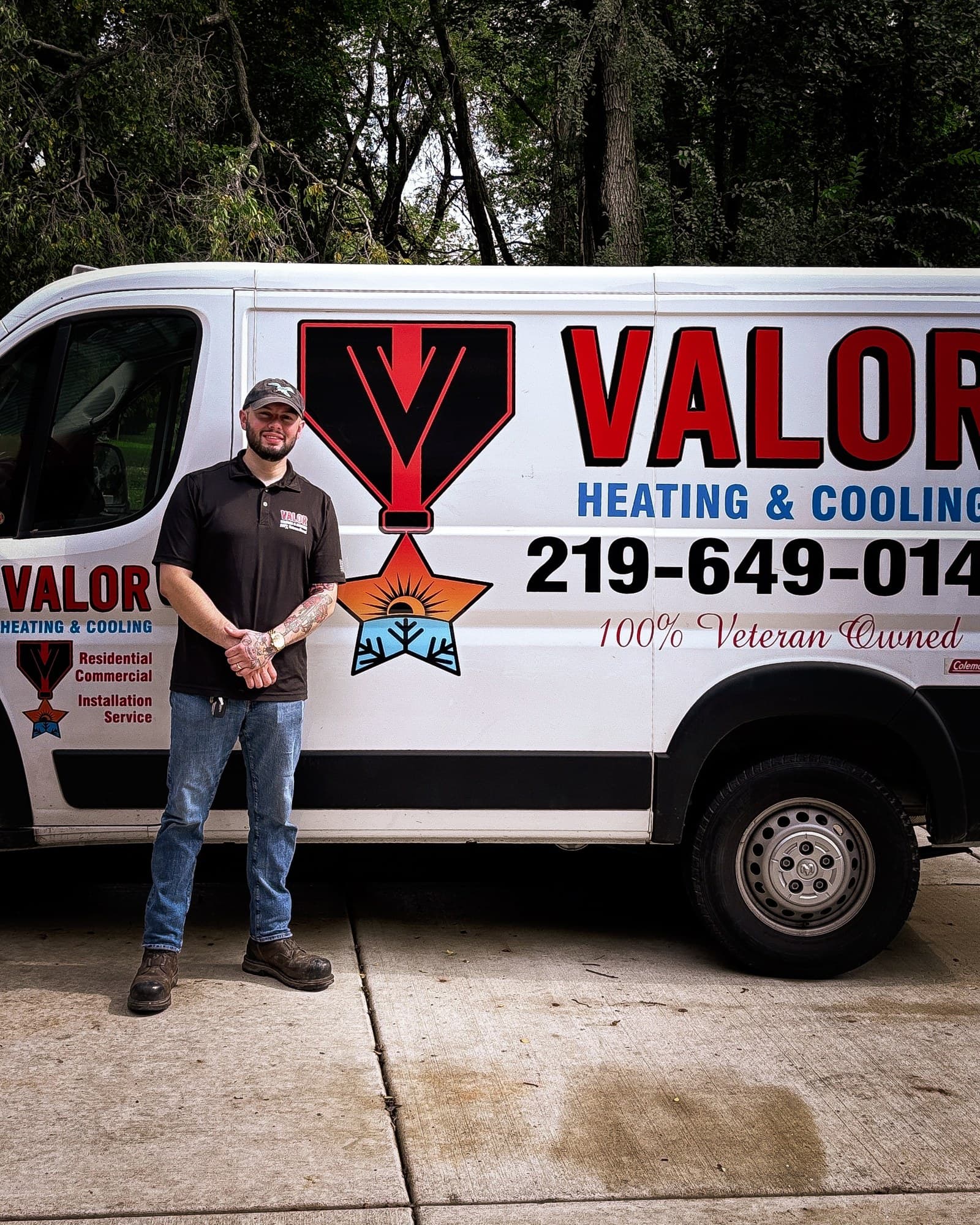 Matt Pomales, owner of Valor Heating and Cooling, in front of the company van